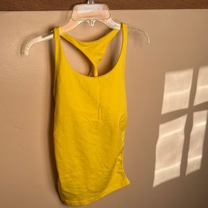 This Bebe top is built-in
shelf bra for a smooth looks
23” length size M/L